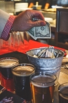 Tips over fill the bucket of Squatters staff as they worked diligently to keep us all from dying of hunger and thirst. Photo: Talyn Sherer