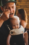Joshua Moreland and his baby Finn were infatuated with the food being served up. Photo: Talyn Sherer