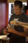 Ryan Moore of The Troubles focused on playing his guitar. Photo by www.jessicabundyphotography.com