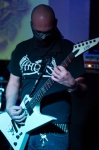 The masked Knephas of Odium Totus shreds in the dark. Photo by Madi Smith
