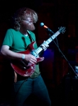 Secrist headbangs as he strums. Photo by Madi Smith