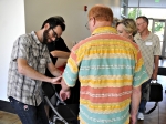 David Childs, KUER's membership assistant, helps attendees check in for the evenings festivities. Photo by Scott Frederick