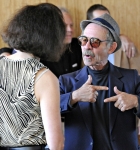 Eric Williams, brother of the guest of honor, chats it up with another attendee. Photo by Scott Frederick