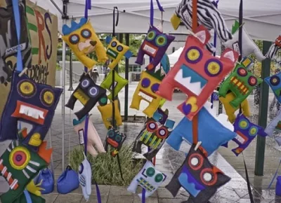 Crafts for sale on display at a Craft Lake City artist booth.