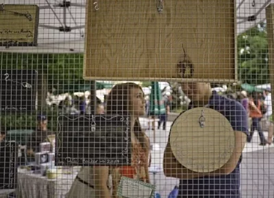 A woman and man engaging in conversation at Craft Lake City 2009.