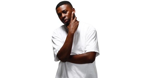 GZA poses with his hand on chin against white background