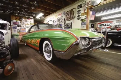 Custom lime green car with orange detailing at Bo Huff's customs shop.