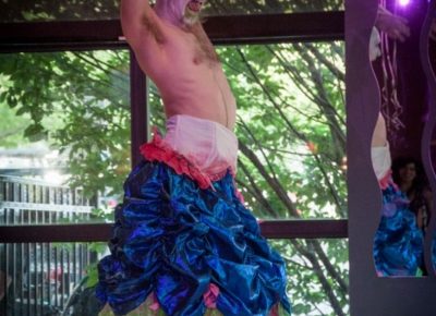 Performer with painted face at Gods, Goddesses & Monsters Pageant