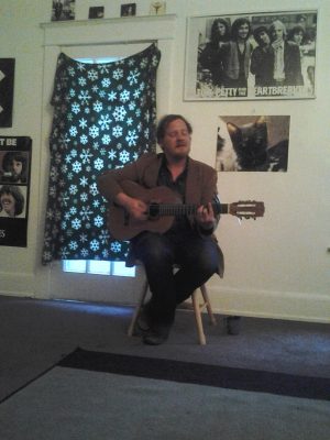 Michael Nau of Cotton Jones plays a small, living room show. 