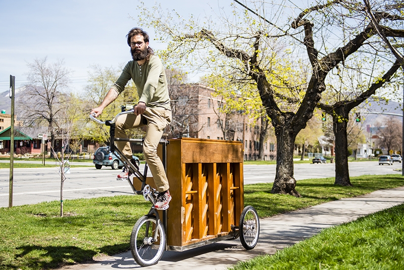 Upright Piano Fuses With Man on Bike