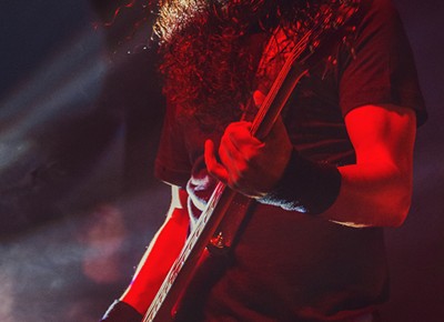 Bassist Mike Inez absorbs the red lights while performing with Alice in Chains. Photo: Talyn Sherer