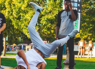 Near the south entrance a group of breakdancers showcase their skills to the sounds of DJ J Godina playing overhead.