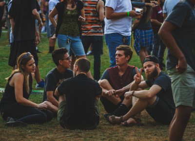 A group of friends wait peacefully for Bishop Nehru to take the stage.