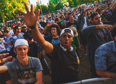 One fan gets his hands up as he excitedly awaits the arrival of Bishop Nehru.