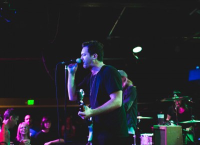 Singer and guitarist Adam Roth singing to the crowd at Urban Lounge in SLC.