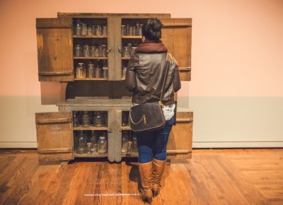 A woman looks into “Grandma’s Cupboard” by artists Mel Ziegler and Kate Ericson. Photo: Talyn Sherer