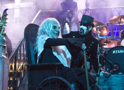 (L–R) Grandma and King Diamond roll onto the stage during "Out From the Asylum." Photo by Madi Smith.