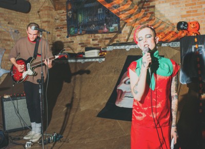 Robin Banks (dressed as a strawberry) sings "We Got the Beat" as The Go-Go's (Foster Body). Photo: Tyson Call @clancycoop