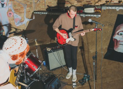 Korey Martin playing guitar for The Go-Go's (Foster Body). Photo: Tyson Call @clancycoop