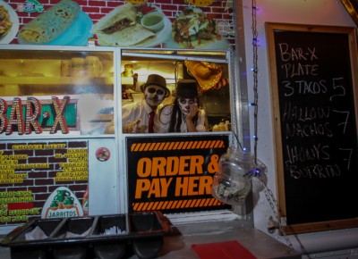 The Bar X Taco Cart servers wore painted sugar skulls as they served late night snacks. Photo: John Barkiple