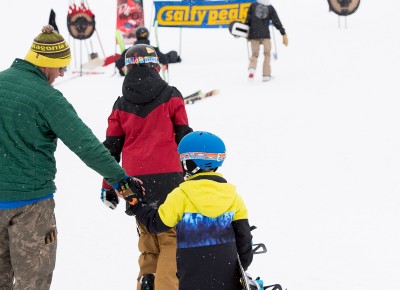 Perhaps the youngest rider in the competition gives a high five after a crowd-pleasing run. Photo: Niels Jensen