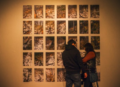 A couple gets intimate as they cuddle up to Paul Crow's "Trail Two, Autumn" display. Photo: talynsherer.com