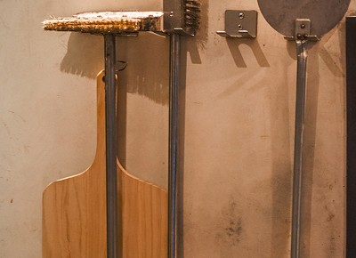 The tools of the trade hang on the wall for any Handle chef who has mastered the art of the wood-fired oven. Photo: Talyn Sherer