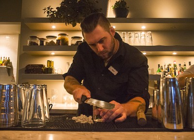 One of my favorite activities throughout the night was watching the bartender shave perfectly clear ice blocks in preparation for the cocktails. Photo: Talyn Sherer