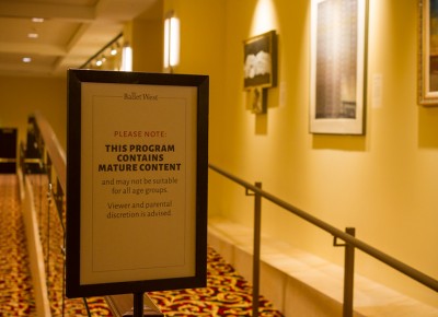 The parental advisory sign rests at the theatre entrance to forewarn all attendees. Photo: Talyn Sherer