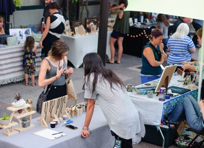 Katia Racine (L) tries on a ring made by Blair Bryant of Alti Studio. Photo: @snowlenda