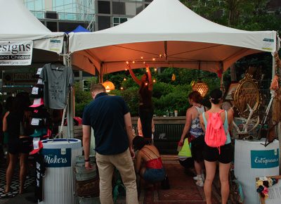 Makers hang lights as the sun sets over the DIY Fest. Photo: @snowlenda