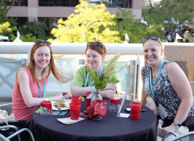 (L–R) Michelle, Stephanie, and Katie grab drinks on Craft Lake City’s VIP patio. Photo: John Barkiple