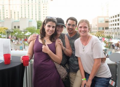 (L–R) Madison Denkers, Sue Denkers, J.D. and Mo snuggle up on the VIP Patio. Madison has loved the CLC DIY Festival for years, and she’s thrilled to support local businesses. Photo: John Barkiple