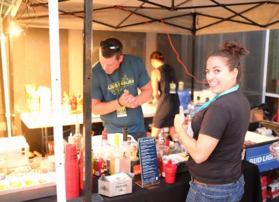 Uinta Brewing's Jamie Horton orders a drink from the CLC VIP bar. Photo: John Barkiple