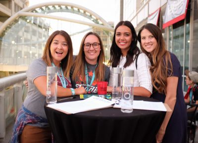 (L–R) Hillary Searle, Andy Walker, Haley Wilson and Briaunna Hallman circle up for a photo on the VIP patio at Craft Lake City’s DIY Festival. Walker, the Assistant Marketing Manager at Harmons, likes how CLC showcases local vendors and products, many of which Harmons stocks throughout the year. Photo: John Barkiple