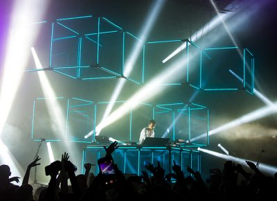 The blue cubes, inspired by his "infinity prism," hover above Flume and the crowd, creating an energetic ambience. Photo: Colton Marsala