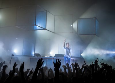 Flume stands before the frenzied crowd, joining his voice with the roar of the crowds. Photo: Colton Marsala