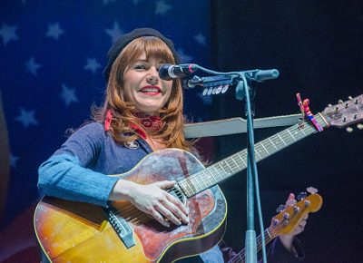 With a schoolgirl smile, Jenny performs for an appreciative crowd. Photo: Scott Frederick