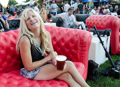 Lynette Mickelsen enjoys a beer in the VIP section before Jenny Lewis hits the stage. Photo: Scott Frederick