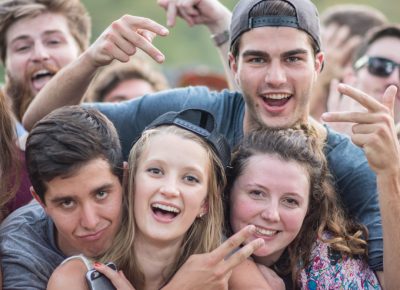 Fans gather to enjoy the music—big smiles all around. Photo: Colton Marsala