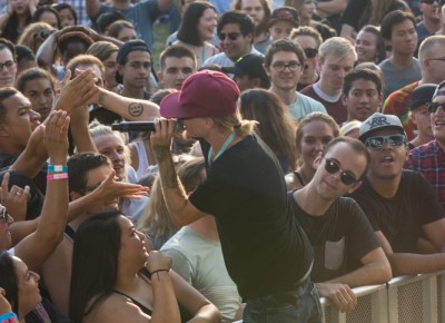 Burnell Washburn hops down from the stage to show appreciation to early arrivals. Photo: Colton Marsala