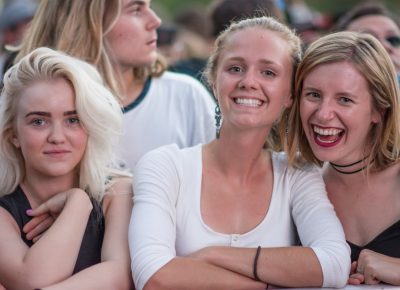 (L–R) Kennedi, Mia, and Malinna crowd the front of the stage, waiting for Big Grams to come on. Photo: Colton Marsala