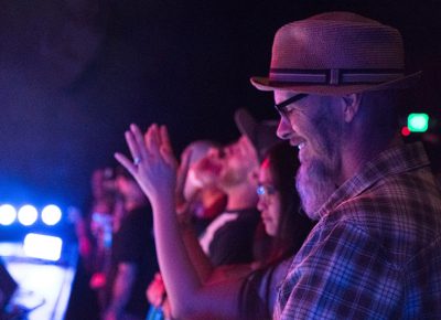 A crowd member has a genuine smile of happiness as he hears Black Joe Lewis and the Honeybears at The State Room. Photo: JoSavagePhotography.com