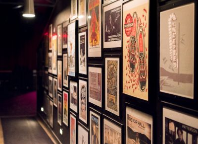 The hallway in The State Room that connects the bar to the stage area is lined with posters from past performers. Photo: JoSavagePhotography.com