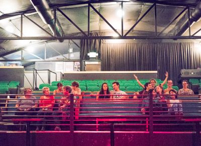 Early arrivals hang out in the church pews in the stage area, by the bar or outside on the patio. Photo: JoSavagePhotography.com