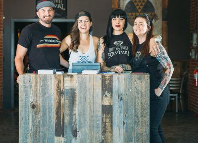 (L–R) Jay Bauer, Kim Jacobsen, Kerri Jones and Sam "Bronco" Maclin pose as the entrance to the event. Photo: @clancycoop