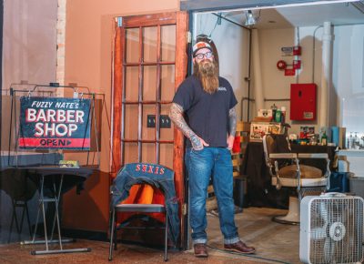 Nate Busch of Fuzzy Nates Barber Shop poses next to his pop-up shop, where he was busy offering cuts and shaves throughout the event. Photo: @clancycoop