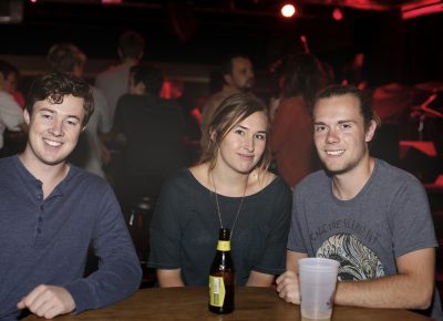 Nick Mayberry, Ally Perry and Mason Maag casually hang at a table while the set changes. Photo: Logan Sorenson @Lmsorenson