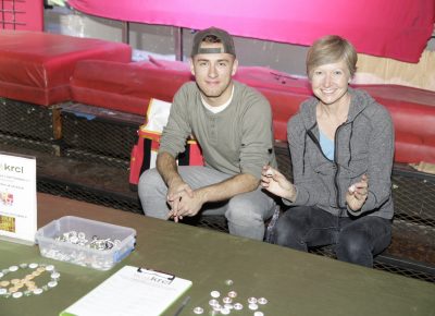 KRCL volunteers Jared and Camille signing up people and giving out buttons. Photo: @Lmsorenson