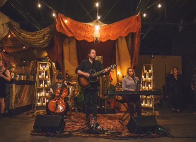 Book on Tapeworm perform under the Edison-bulb string lights and the intense focus of the crowd. Photo: Talyn Sherer